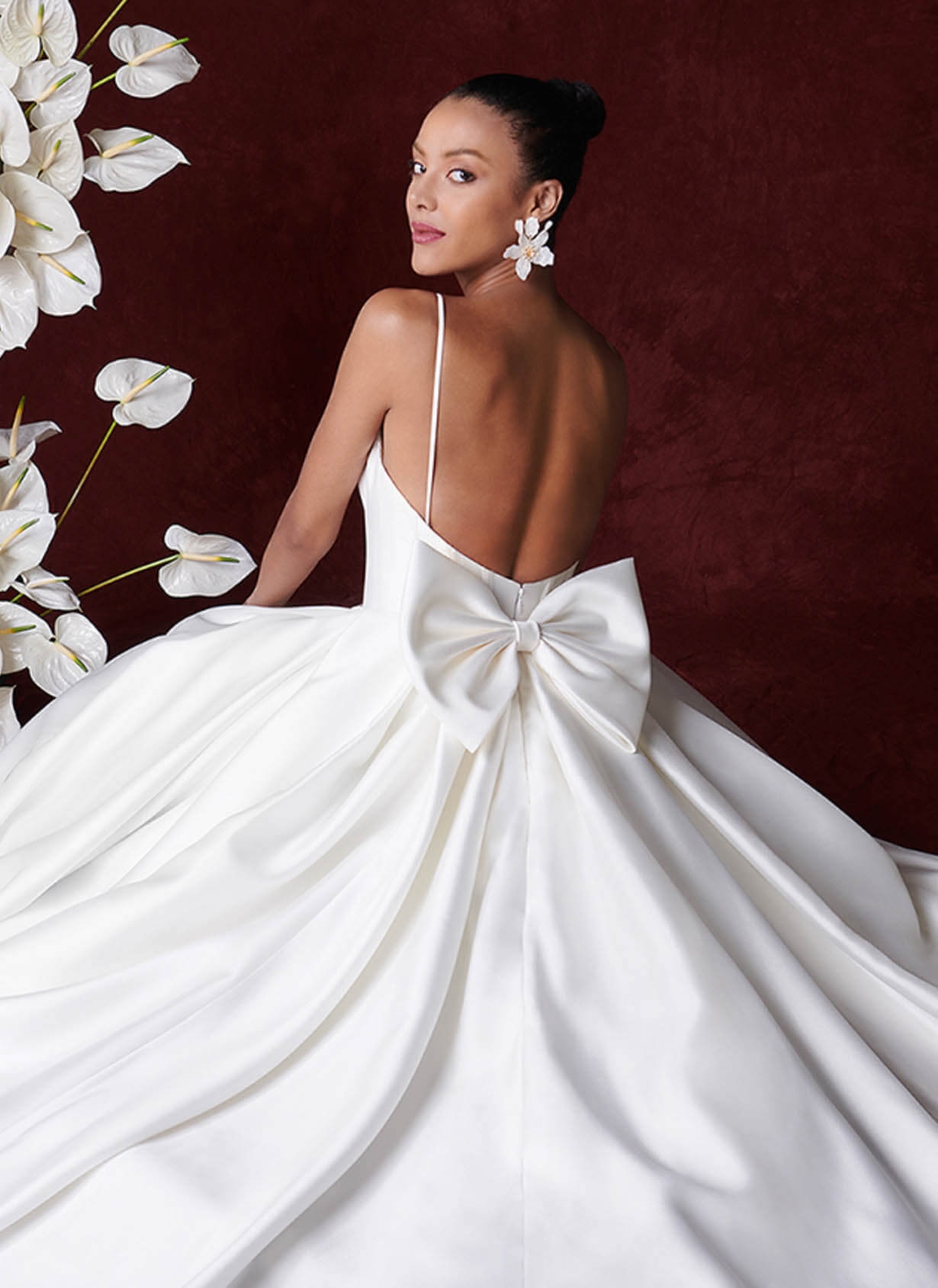 Model wearing a gown by Justin Alexander